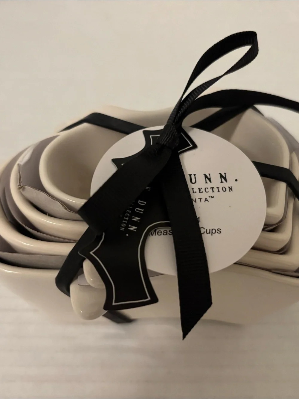 Rae Dunn Cream Ceramic Nested Measuring Cups with Black Ribbon